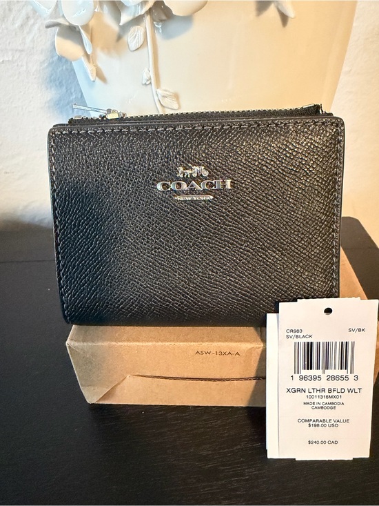 Coach Handbags - Coach Black Textured Leather Zip Wallet with Silver Logo